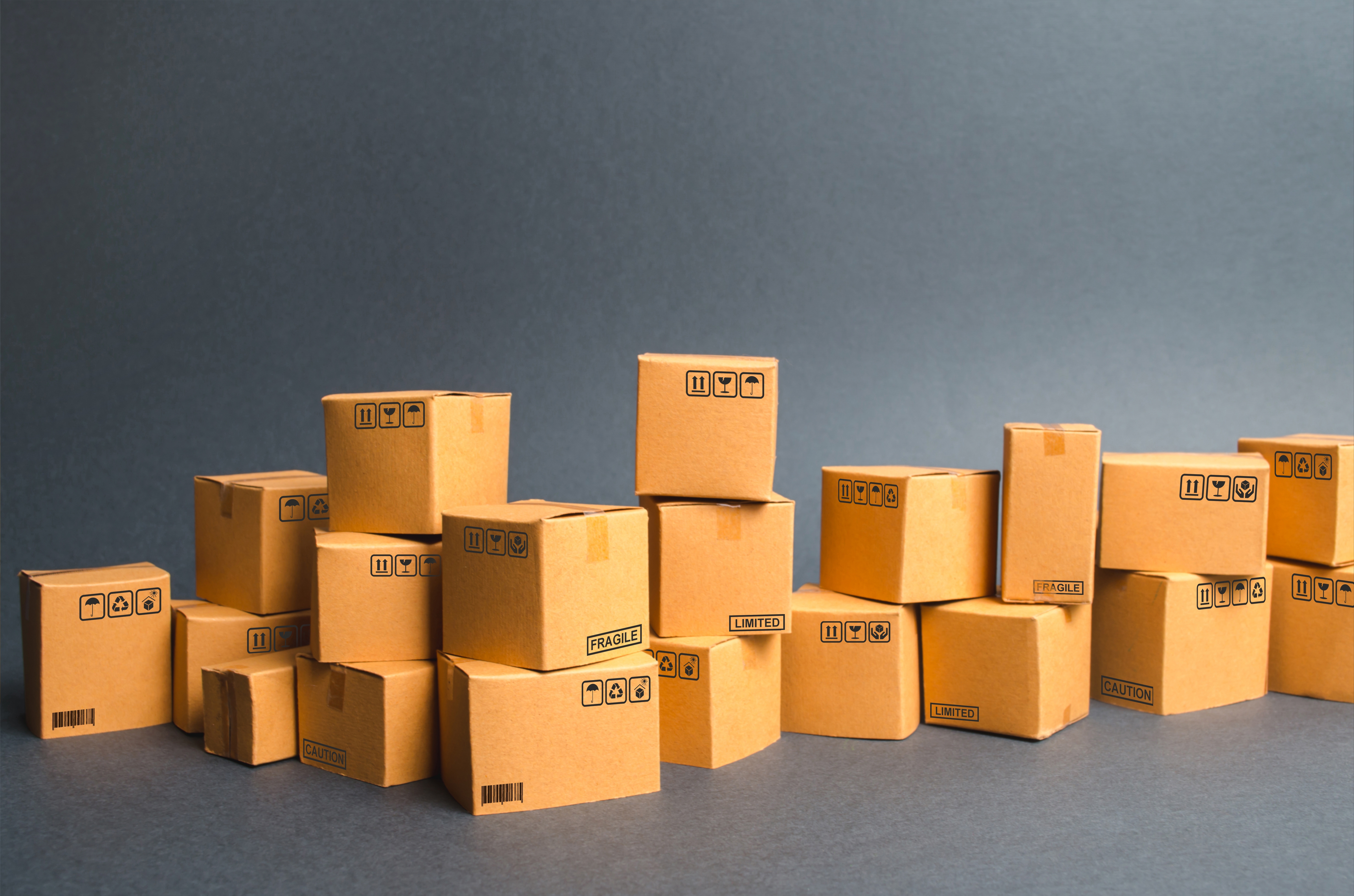 Many cardboard boxes. products, goods, Warehouse, stock. commerce and retail. E-commerce, sale of goods through online trading platform. Freight shipping, deliver. sales of goods and services.